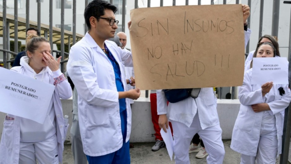 Doctors and nurses in Ecuador's capital protest dismissals in the state health care system