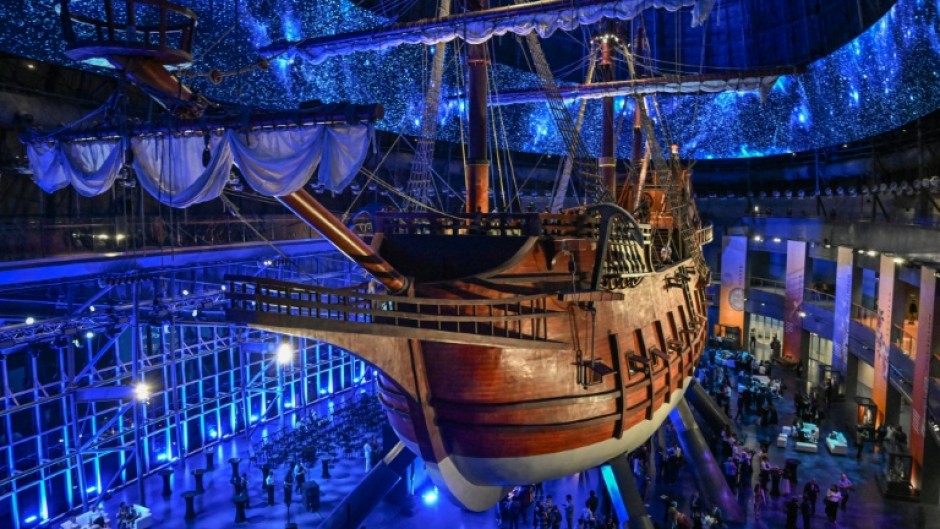 Visitors under the Galeon Espiritu Santo, a full-scale representation of a 17th century galleon, on display at the Museo del Galeon in Manila