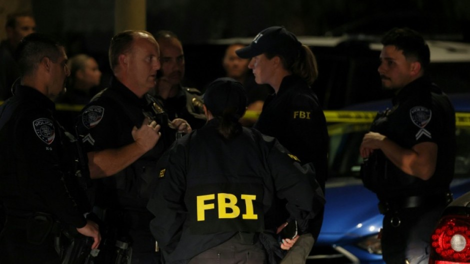 FBI agents are seen outside a residence associated with the alleged White House Correspondents' Dinner shooter in Torrance, California, on April 25, 2026