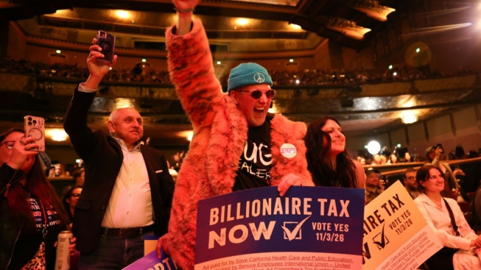 People chant in support of a tax on billionaires during a Bernie Sanders rally in Los Angeles in February