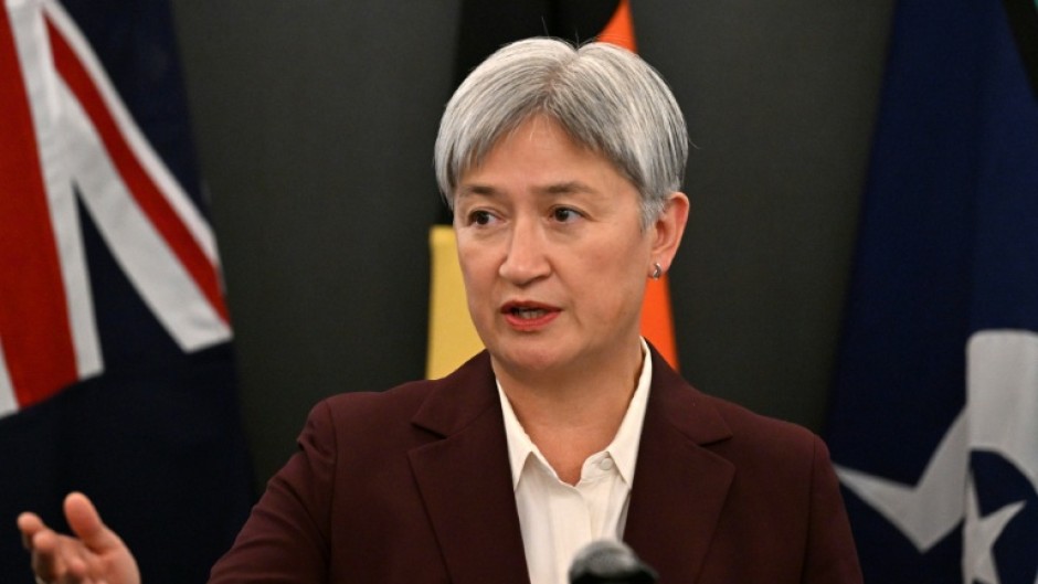 Australia's Foreign Minister Penny Wong addresses journalists during a press conference in Beijing