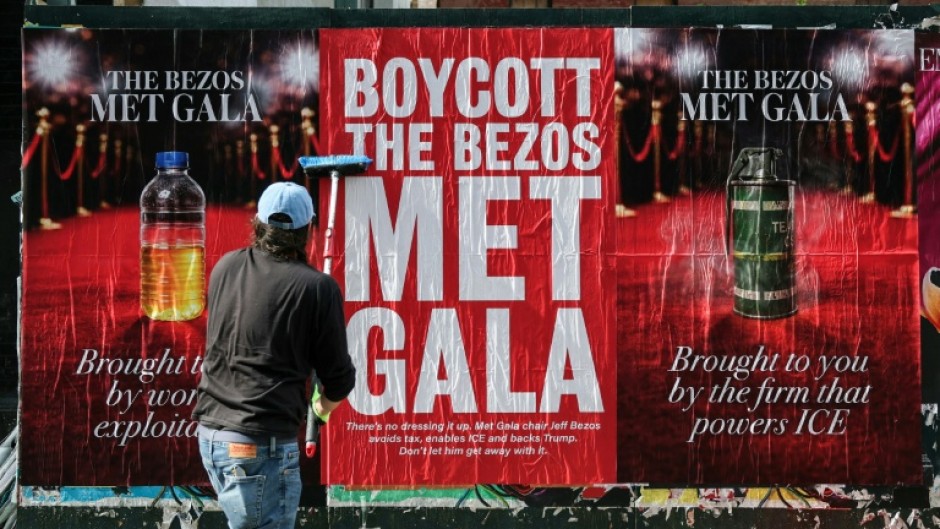 Activists have deployed posters to oppose Jeff Bezos's involvement in the Met Gala