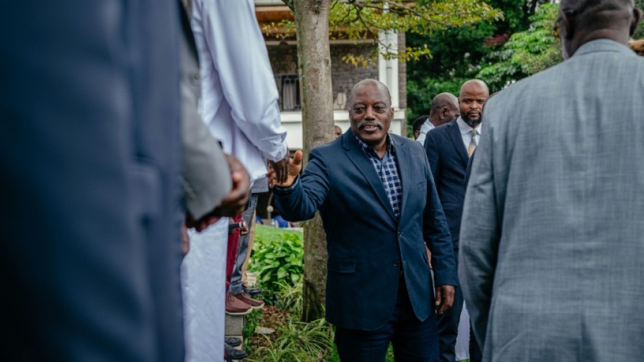 Former president of the Democratic Republic of Congo Joseph Kabila greets traditional leaders after a meeting at one of his residences in Goma on May 30, 2025