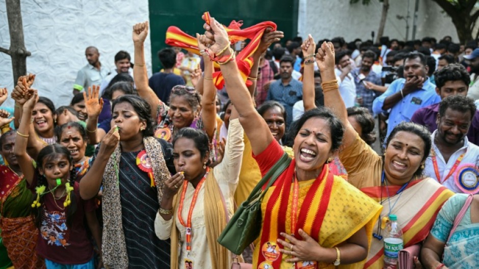 Supporters and members of Indian actor C. Joseph Vijay's Tamilaga Vettri Kazhagam party celebrate after TVK leads in Tamil Nadu Legislative Assembly elections
