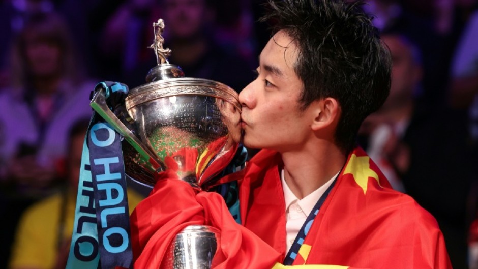 China's Wu Yize celebrates winning the World Snooker Championship