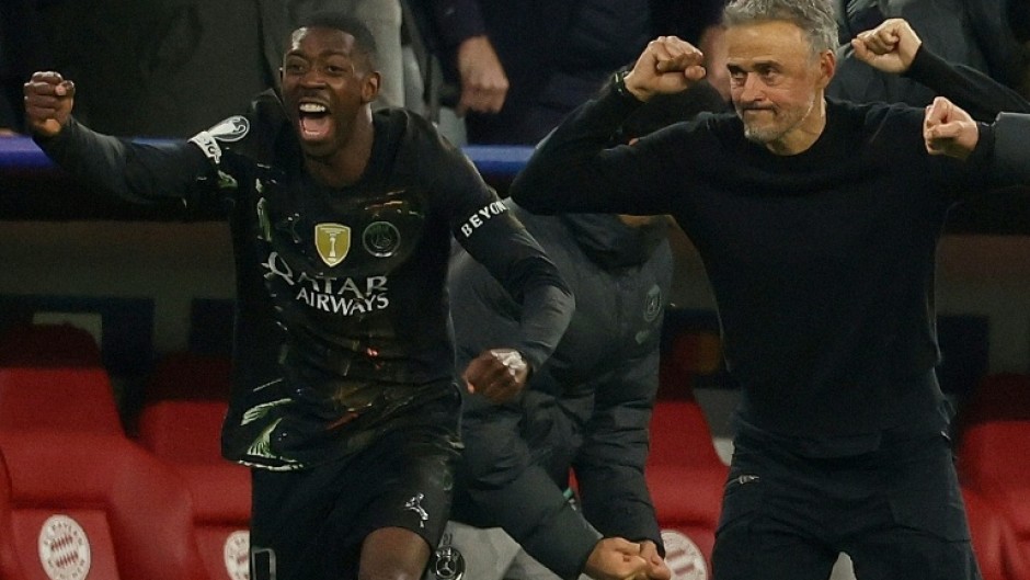 PSG coach Luis Enrique (R) and Ousmane Dembele begin the celebrations after holding off Bayern Munich to reach another Champions League final