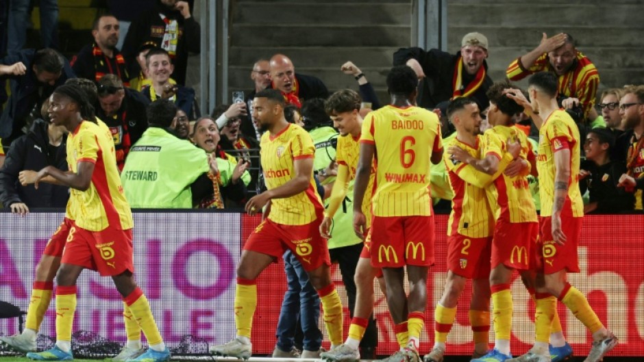 Lens celebrate after the goal from Mezian Mesloub Soares (2nd R) that secured them Champions League football next season