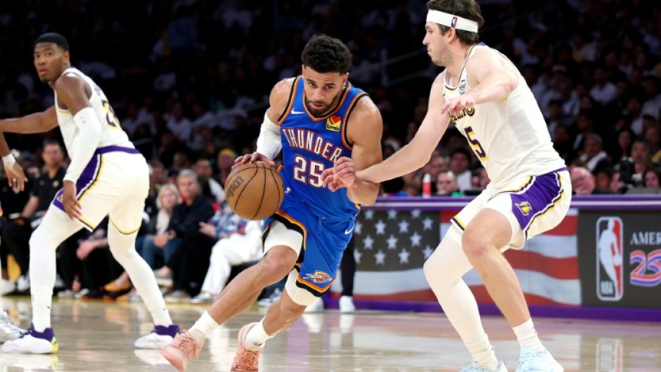 Oklahoma City's Ajay Mitchell drives to the basket against Austin Reaves of the Los Angeles Lakers in the Thunder's win in game three of their NBA playoff series
