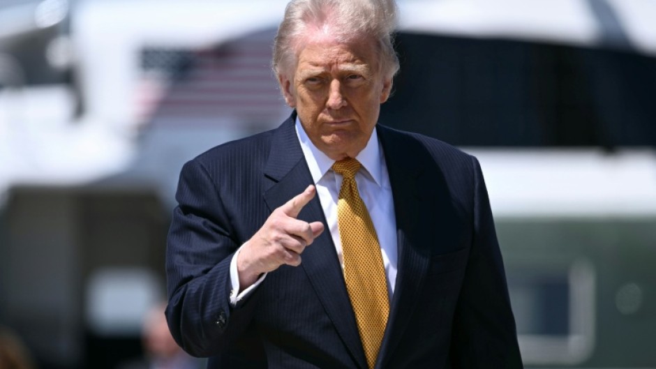 US President Donald Trump, pictured boarding Air Force One on May 12, 2026, notified Congress of strikes against Iran in early March