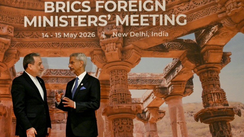 India's Foreign Minister Subrahmanyam Jaishankar (R) speaks to Iranian counterpart Abbas Araghchi at the opening of the BRICS Foreign Ministers’ Meeting in New Delhi