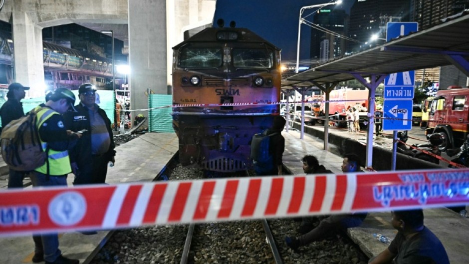 The driver of a train that collided with a bus in Bangkok was charged with negligence causing injury and death
