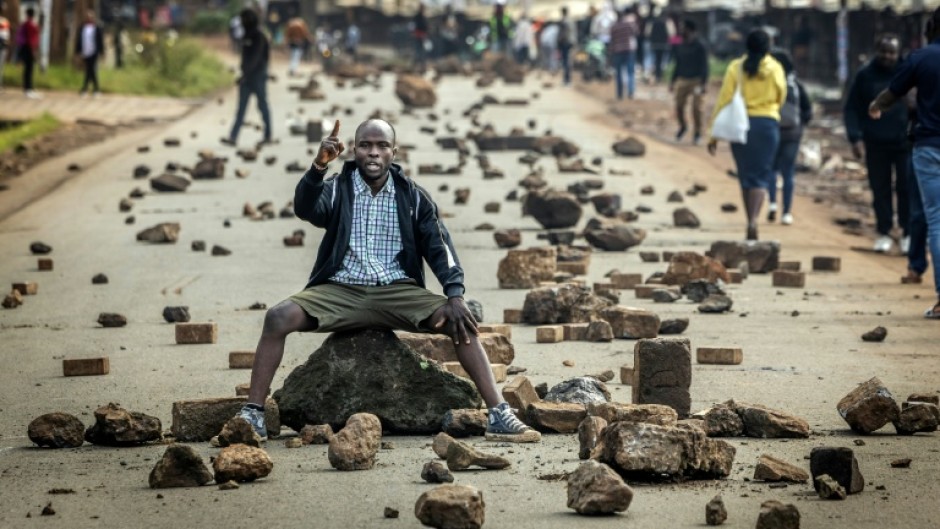 Kenya's public transport system was paralysed when protesters barricaded roads over fuel price hikes