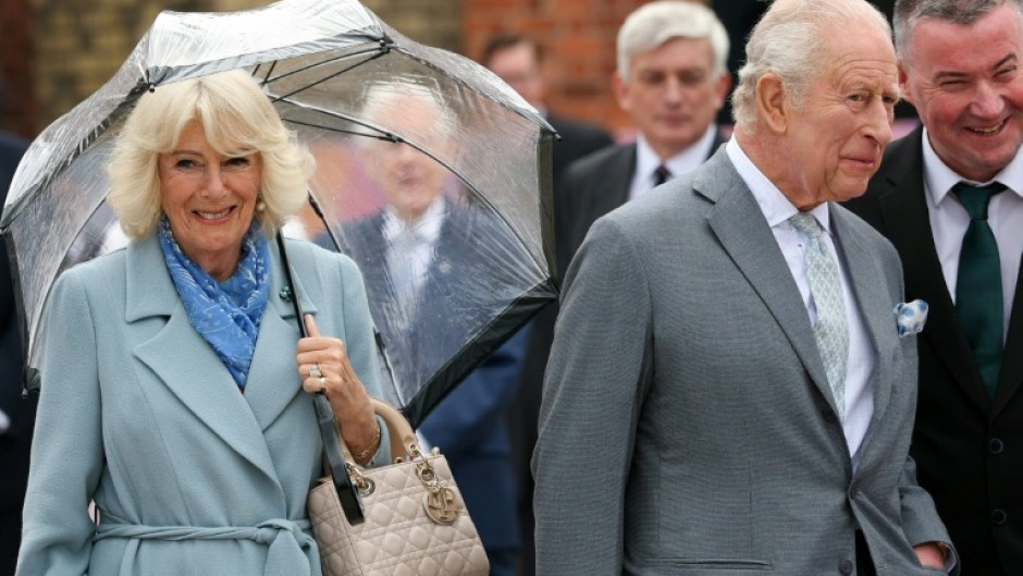 Charles and Camilla heard a performance of traditional Irish music and dance and tried out some of the instruments