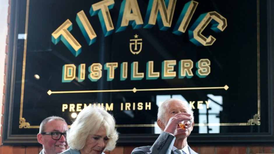 Charles and Camilla sample whiskey during a visit to Titanic Distillers in Belfast, Northern Ireland