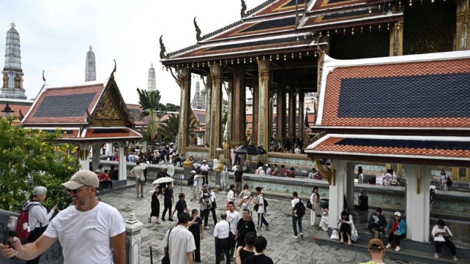 Visitors walking around the Grand Palace in Bangkok