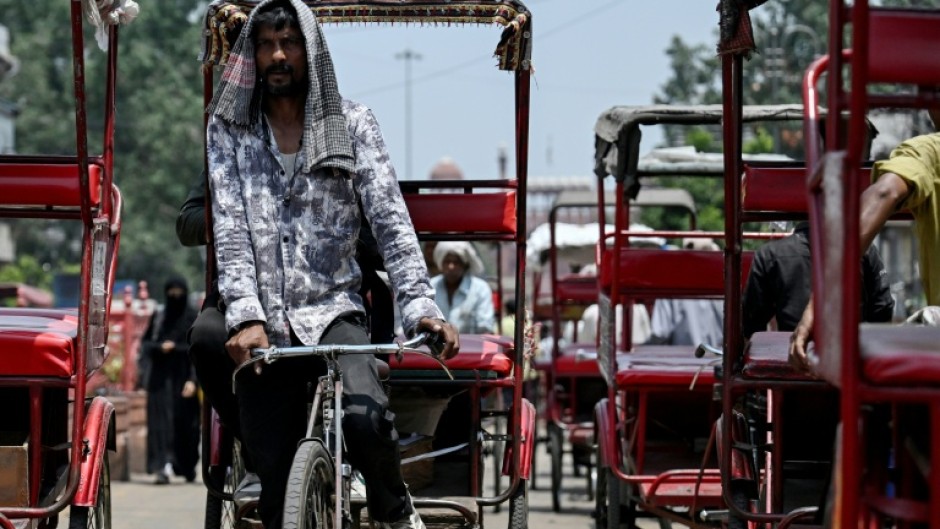 A rickshaw puller in Delhi, where temperatures hit 45C on Thursday. The South Asian country of 1.4 billion people is no stranger to scorching summers, with routine heatwaves between April and June