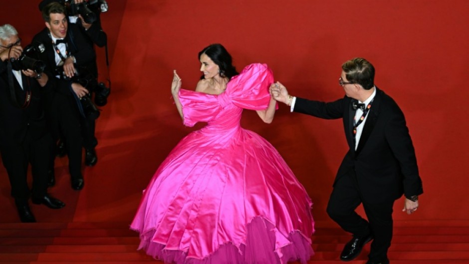 Demi Moore does Barbie at the Cannes Film Festival in a gown by edgy French label Matieres Fecales