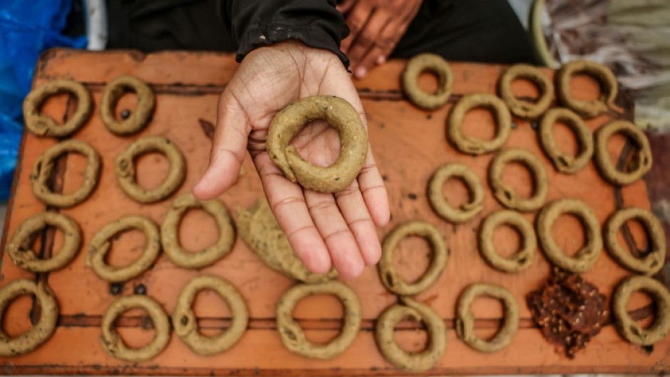 Very few Palestinians are able to make Eid biscuits in their tents due to high prices of cooking gas
