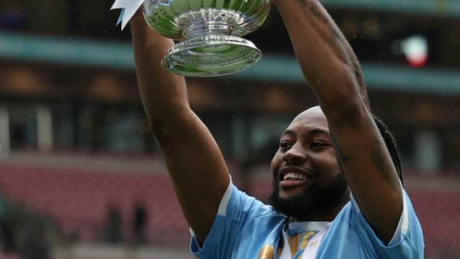 Antoine Semenyo holds aloft the FA Cup. His goal secured Manchester City a 1-0 win over Chelsea at Wembley