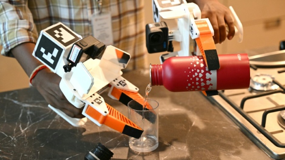 At an Objectways studio, AI system trainers film themselves performing household tasks in fake, fully furnished apartment rooms