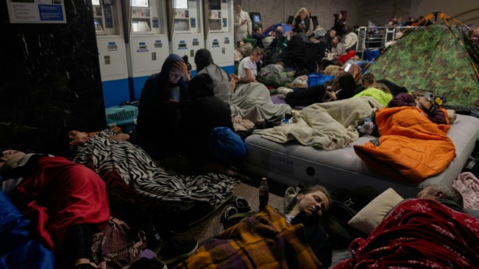 People take shelter at a metro station during an air alarm in Kyiv on June 2, 2026, amid the Russian invasion of Ukraine