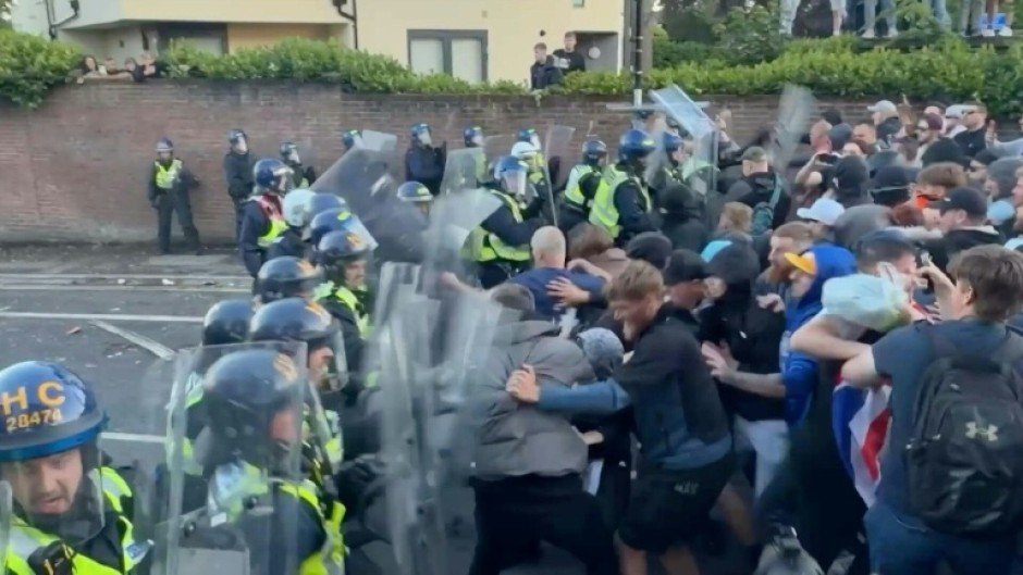 Protesters and police clash at UK rally over student murder