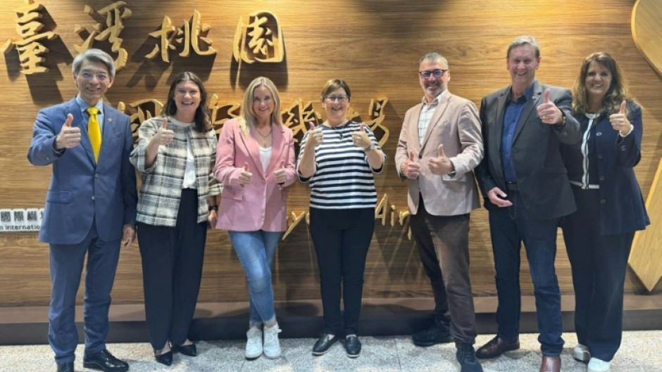 New Zealand lawmakers Maureen Pugh (C), Duncan Webb (3rd R), Laura McClure (3rd L) and David Wilson (2nd R) took part in the trip
