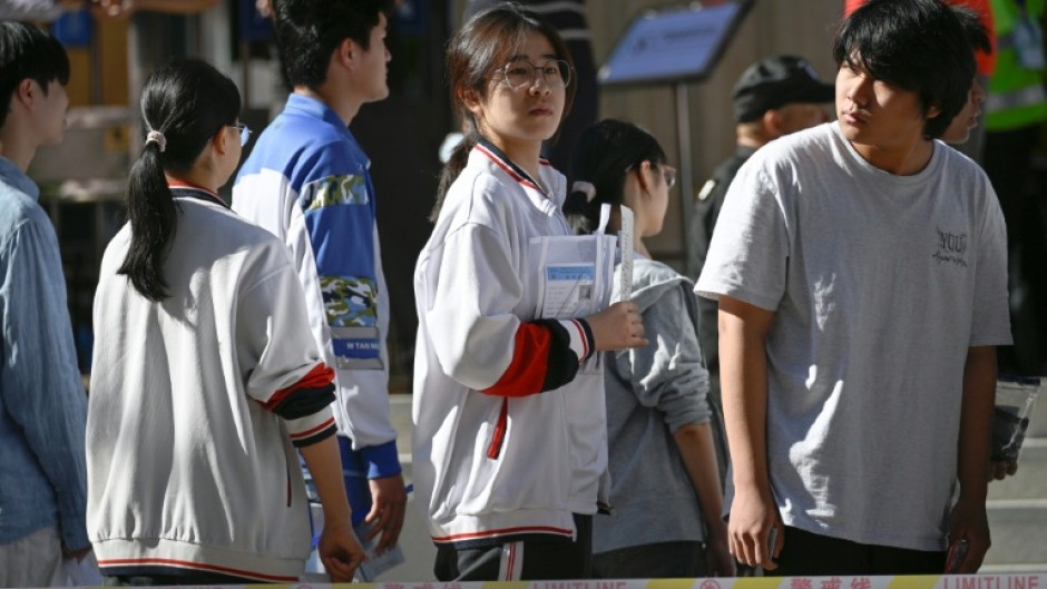 Some students were still cramming as they waited in line to sit the exam
