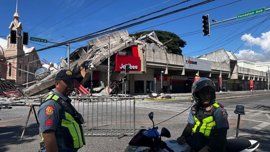 Buildings including a Jolibee restaurant collapsed following a 7.8-magnitude earthquake that hit off Mindanao island