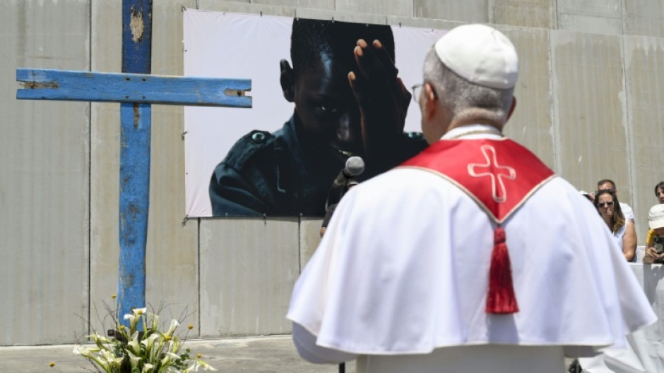The pope blessed a cross made from the wood of migrant boats