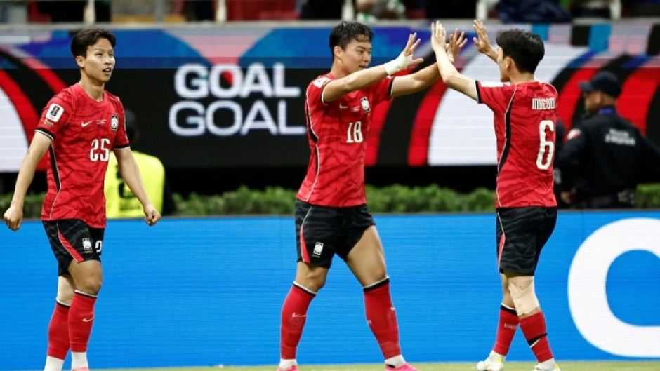 Oh Hyeon-gyu (centre) celebrates after scoring South Korea's winner in their World Cup winner