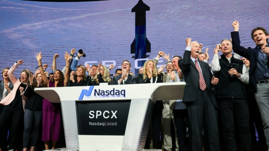 SpaceX employees celebrate the company's Wall Street debut, the largest initial public offering in US history