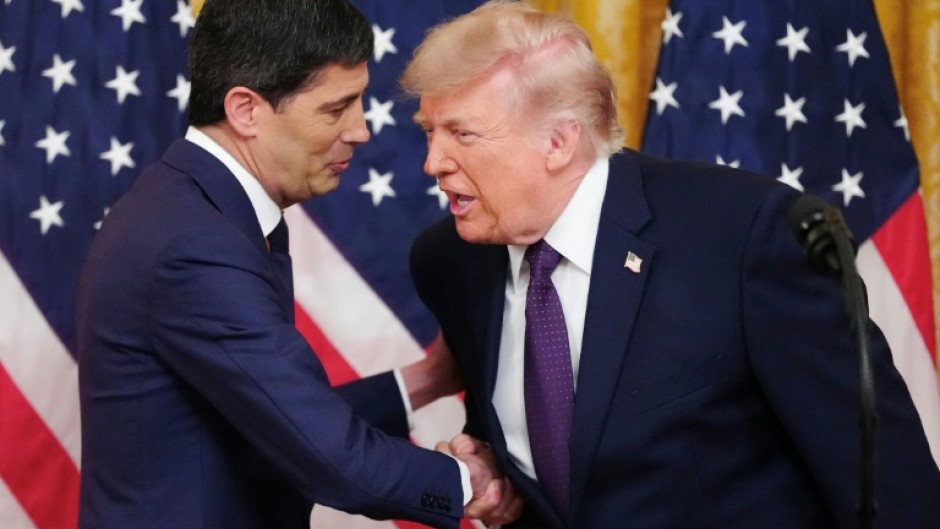 New US Federal Reserve chairman Kevin Warsh (L) is likely to face pressure, as his predecessor did, from President Donald Trump to lower interest rates