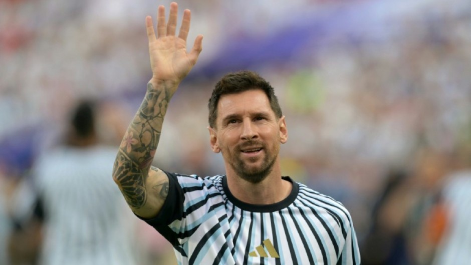 Lionel Messi waves to fans in Kansas City