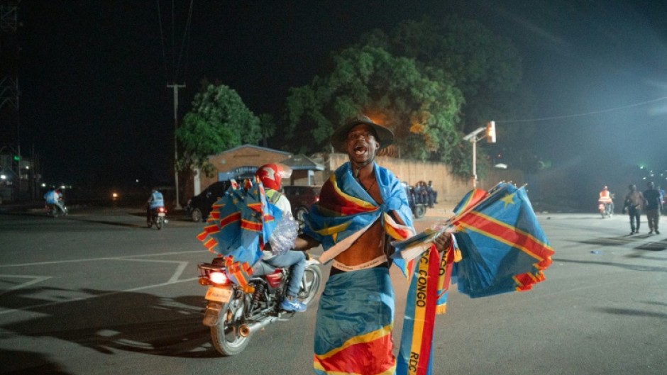 Democratic Republic of Congo fans set aside fears over the Ebola epidemic and celebrated their side's historic World Cup draw with Portugal