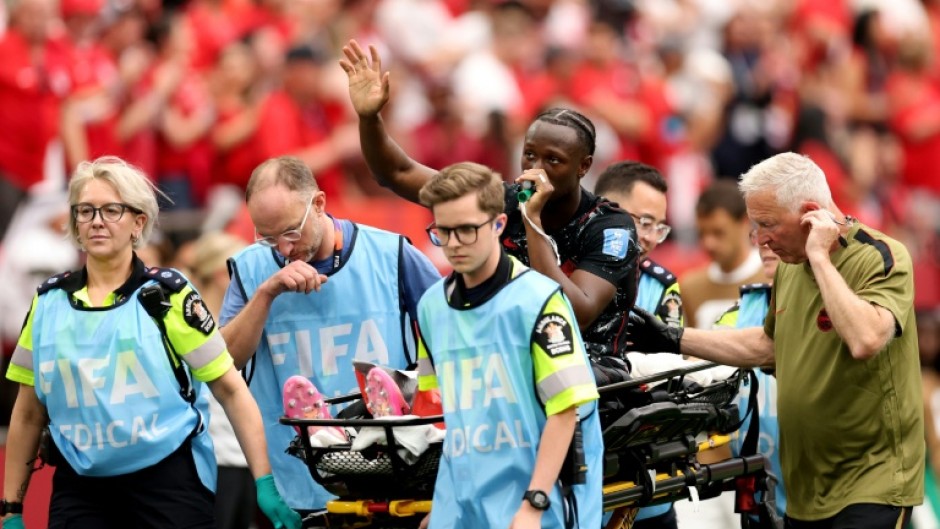 Canada's Ismael Kone waves to the crowd after suffering a serious injury in the 6-0 win over Qatar