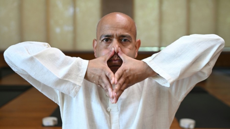 Varun Veer, founder of Lifeyoga, demonstrates 'Pranayama' at his studio in New Delhi