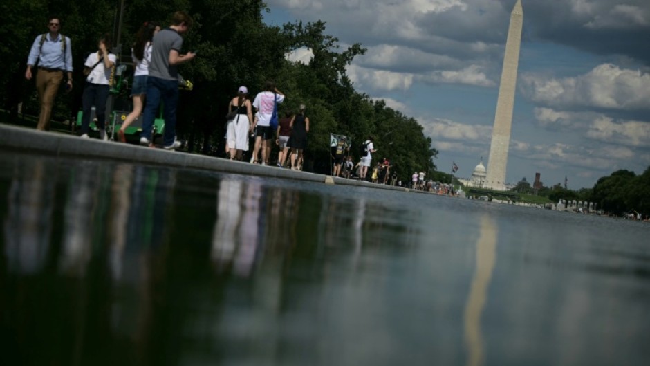 People walk near the Lincoln Memorial Reflecting Pool following the completion of recent renovations in Washington, DC