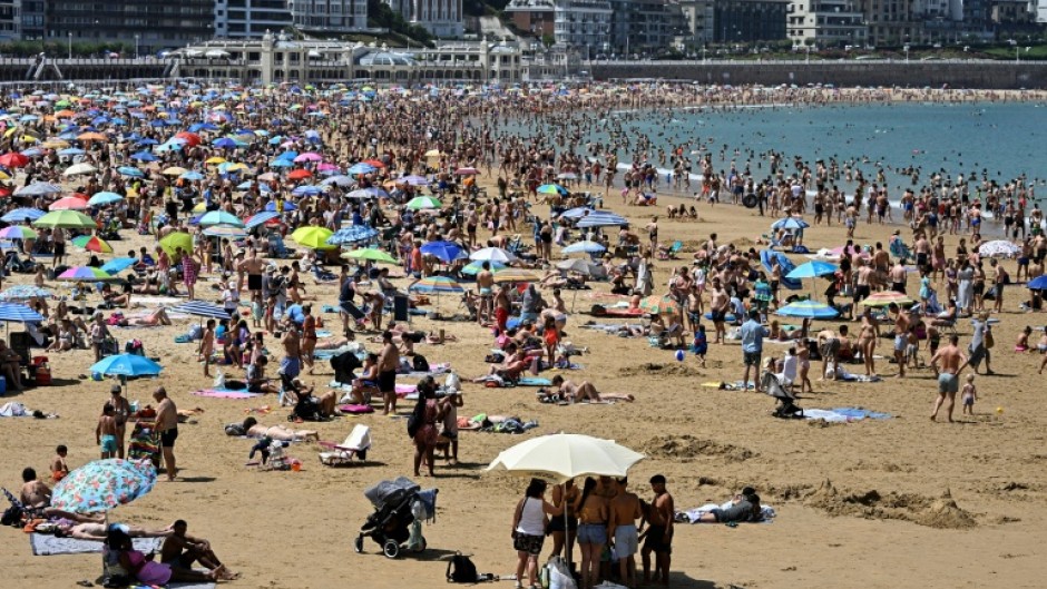 People packed beaches in Portugal and Spain, such as this one in San Sebastian