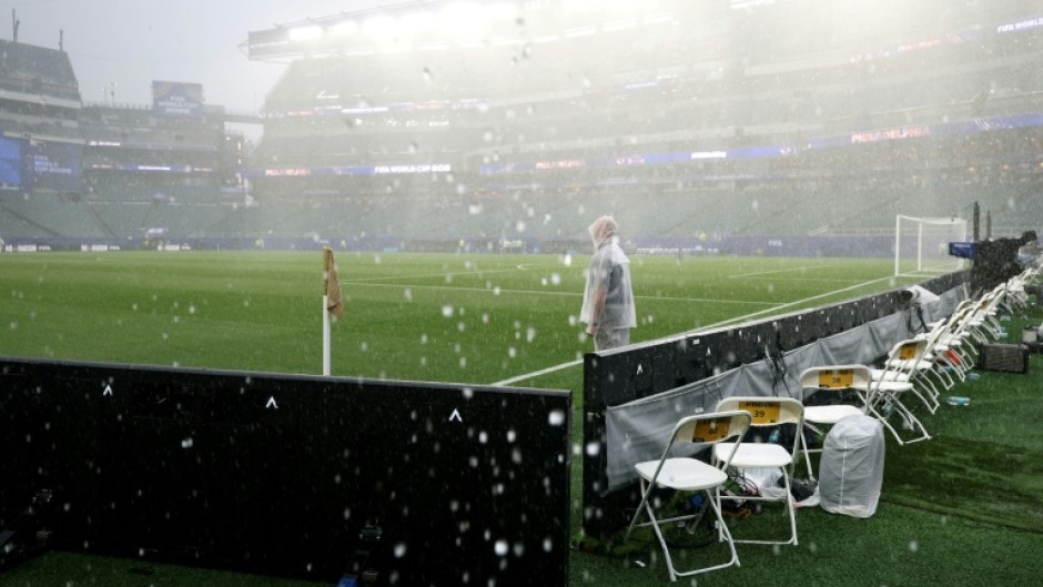 The rain pours onto the World Cup stadium in Philadelphia, forcing France's game against Iraq to be suspended for more than two hours