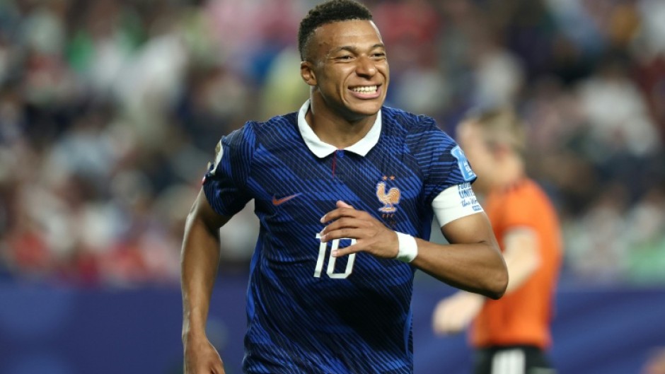 Kylian Mbappe admitted the long storm delay took its toll on France against Iraq -- but he scored two more World Cup goals in their 3-0 win