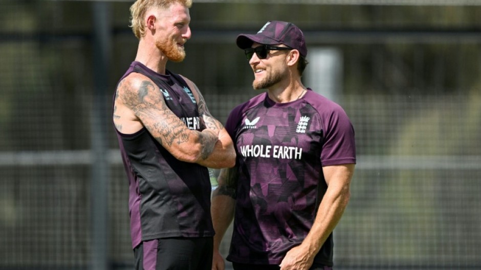 England captain Ben Stokes (L) talks to coach Brendon McCullum