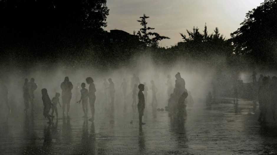 People off in a water fountain in Spain