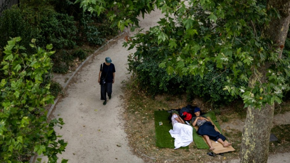 People have taken to the shade to try to beat the heatwave in France
