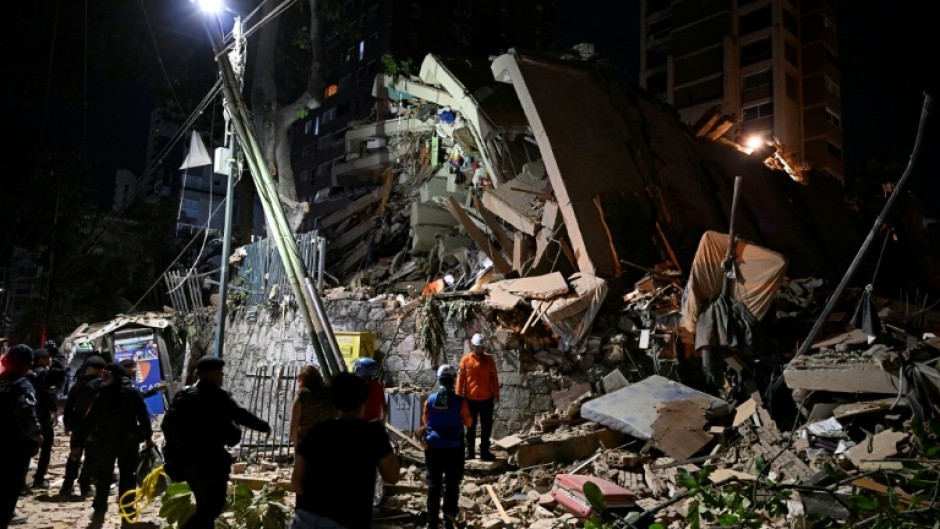 Rescuers searched rubble collapsed buildings for survivors in Caracas following massive twin earthquakes in Venezuela