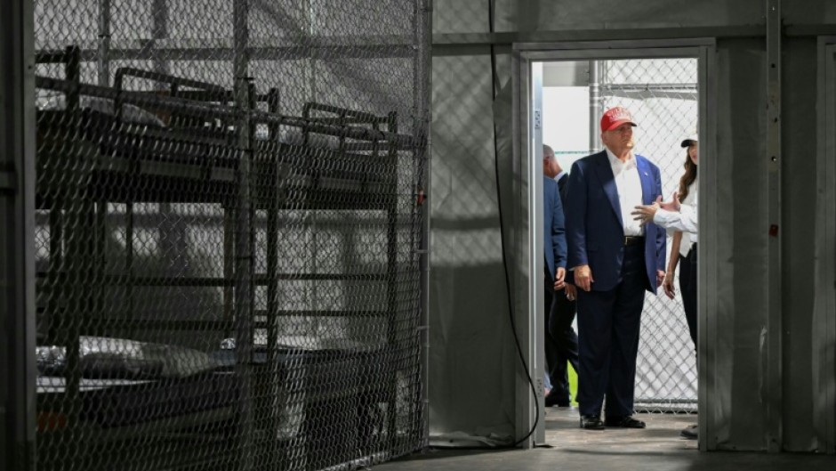 US President Donald Trump, pictured visiting 'Alligator Alcatraz' in 2025, has vowed to deport millions of undocumented migrants
