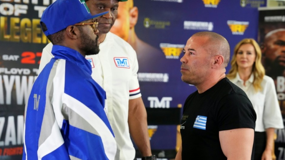 US boxer Floyd Mayweather Jr., left, and Greek kickboxer Mike Zambidis, right, reportedly will not fight on Saturday in an exhibition at Athens as originally announced
