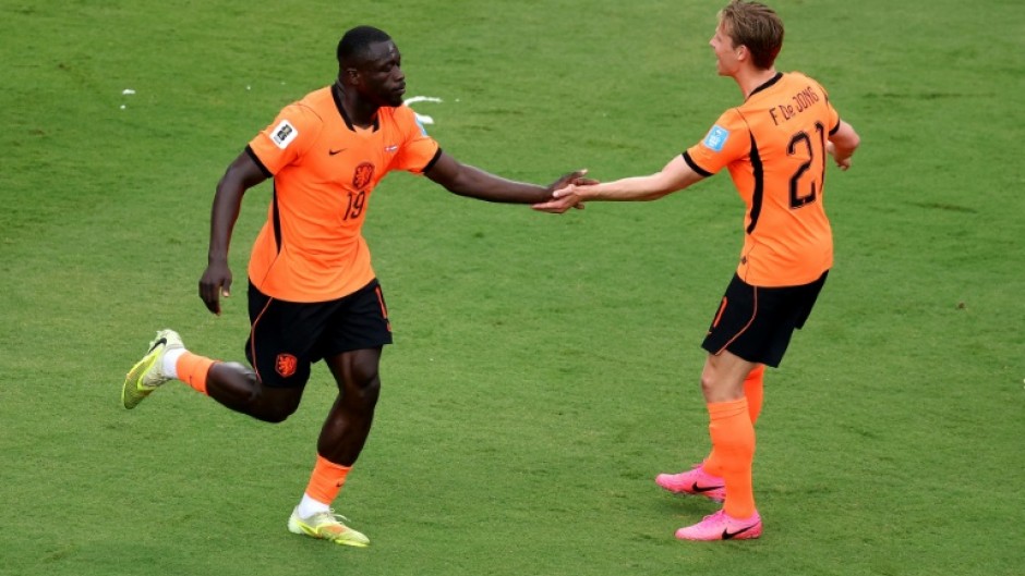 Dutch forward Brian Brobbey (left) celebrates scoring against Tunisia in their World Cup Group F match in Kansas City
