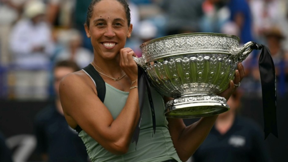 Madison Keys poses with the trophy after beating Tatjana Maria in the Eastbourne final