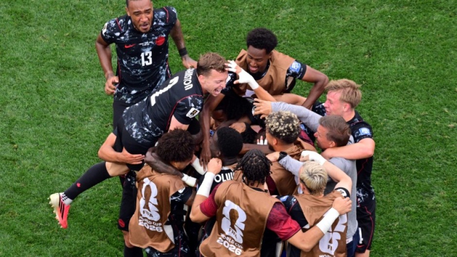 Canada's bench streamed onto the pitch as the stadium eruped